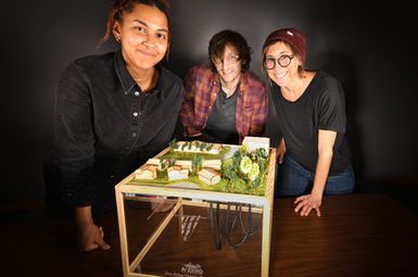 SEAS Master of Landscape Architecture students (from left) Kaia McKenney, Kammer Offenhauser and Teresa Zbiciak with the model of a geothermal energy system they created for the City of Ann Arbor. Photo by Maddie Fox 