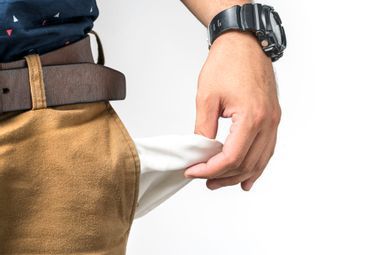 A hand showing an empty pants pocket