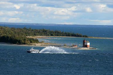 A ferry arrives at Mackinac Island in the Straits of Mackinac, Michigan’s largest tourist draw. AP Photo/Anick Jesdanun