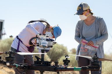 Two researchers in the field