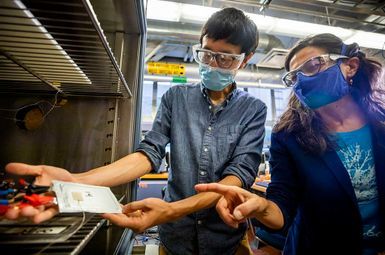 Andrew Weng, a PhD student in mechanical engineering, and Anna Stefanopoulou, the William Clay Ford Professor of Technology, identify an early-life diagnostic signal that predicts the impact of the formation protocols on battery life without needing cycle life testing. Image credit: Robert Coelius/Michigan Engineering Communications & Marketing