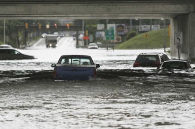 A driver chances the floodwaters in Melvindale, Michigan, during major flooding that hit Metro Detroit in August 2014. Credit: Mandi Wright, Detroit Free Press