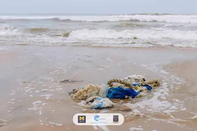 Ocean plastic sits on Laboma Beach. Attendees of the Coastal Ocean Environment Summer School In Nigeria and Ghana, a program started by University of Michigan researcher Brian Arbic, visited the beach as part of a plastics field trip during the 2023 meeting of the summer school. Image credit: COESSING