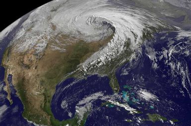 Extratropical cyclones, like the one centered above Minnesota in this satellite image from 2010, are bringing warmer and wetter air to the Great Lakes region in winter. Image credit: National Weather Service