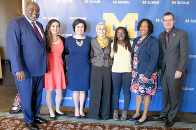 A group photo at the 2019 Professional Development Diversity, Equity, and Inclusion Certificate end-of-year celebration. From left to right: Robert Sellers, Charles D. Moody Collegiate Professor of Psychology, professor of education, and former chief diversity officer at U-M; PD DEI Certificate graduate Rebeca Villegas; PD DEI Certificate graduate Catalina Piatt-Esguerra; PD DEI Certificate graduate Jumanah Saadeh; PD DEI Certificate graduate Raebekkah Pratt-Clarke; Deborah Willis, assistant vice provost for equity, inclusion, and academic affairs and former assistant director of professional and academic development and senior program lead, DEI Certificate Program; Mike Solomon, dean, Rackham Graduate School 