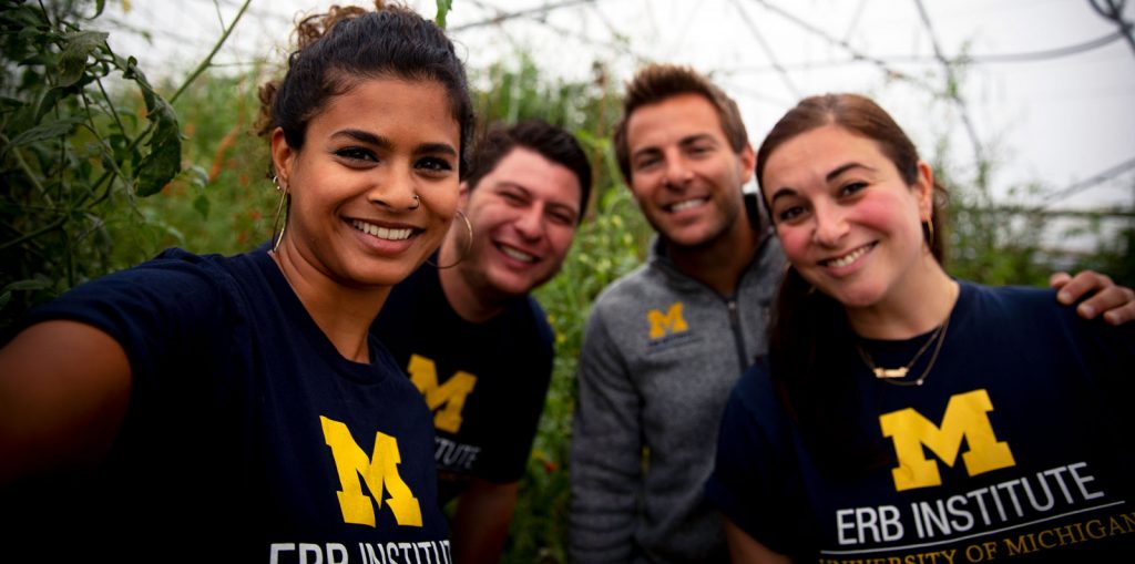 group selfie with people wearing ERB Institute shirts