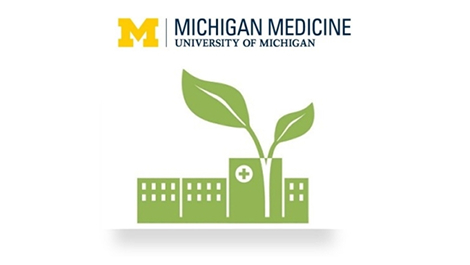 Green hospital building with leaf icon to signify sustainability