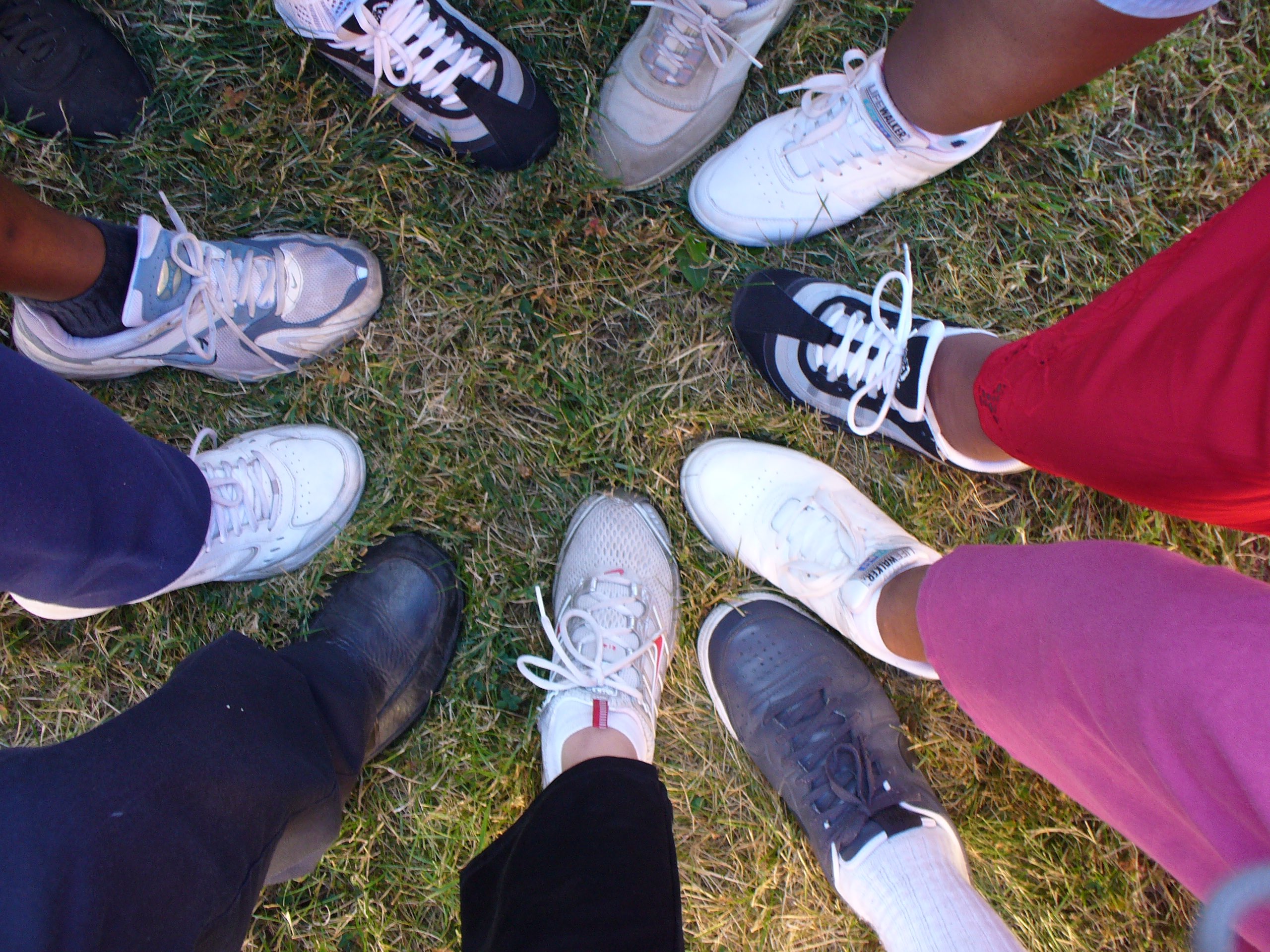 A group of people's feet forming a circle